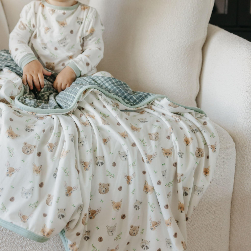 Copper Pearl Wilder blanket in use during swaddling and tummy time routines.