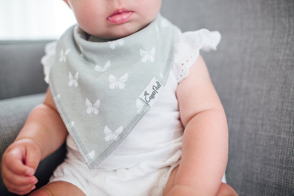 Soft cotton bibs absorb drool, keeping baby's chest dry during feedings