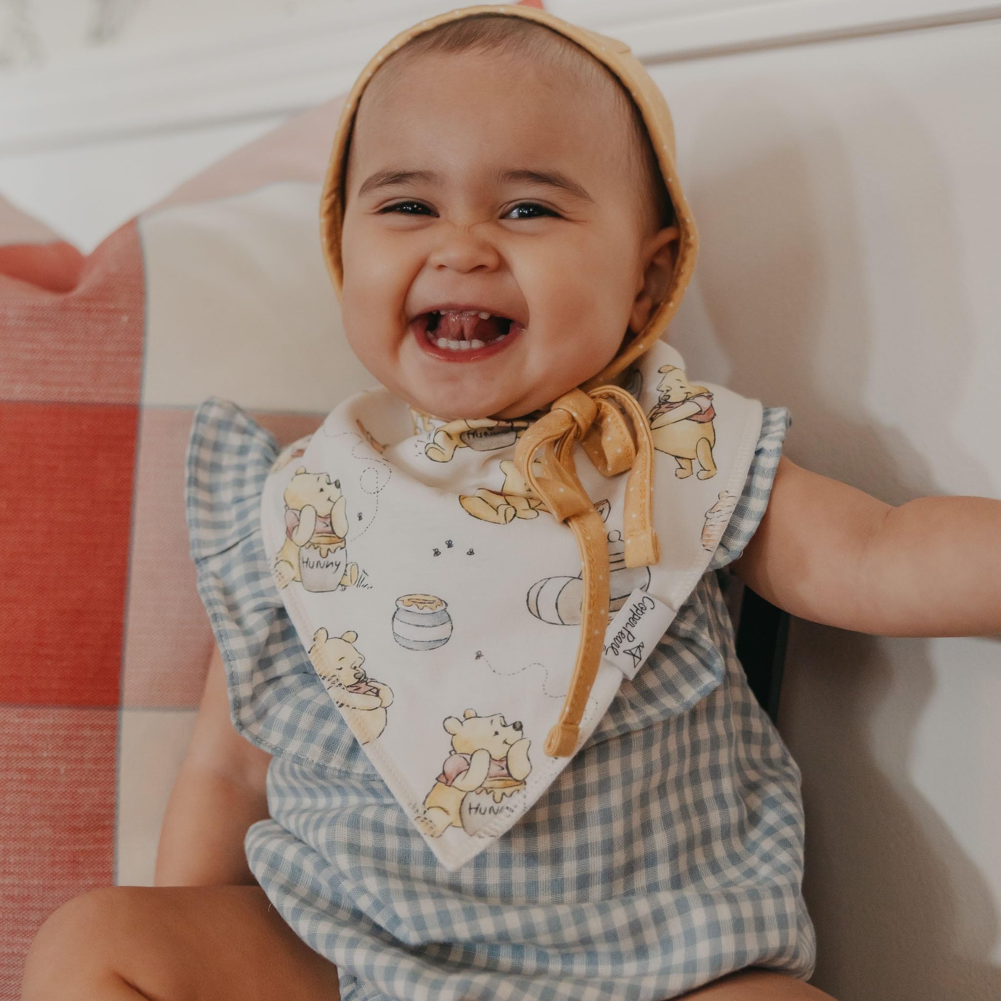 Copper Pearl Winnie Pooh bandana bib adjustable nickel-free snaps for growing babies.