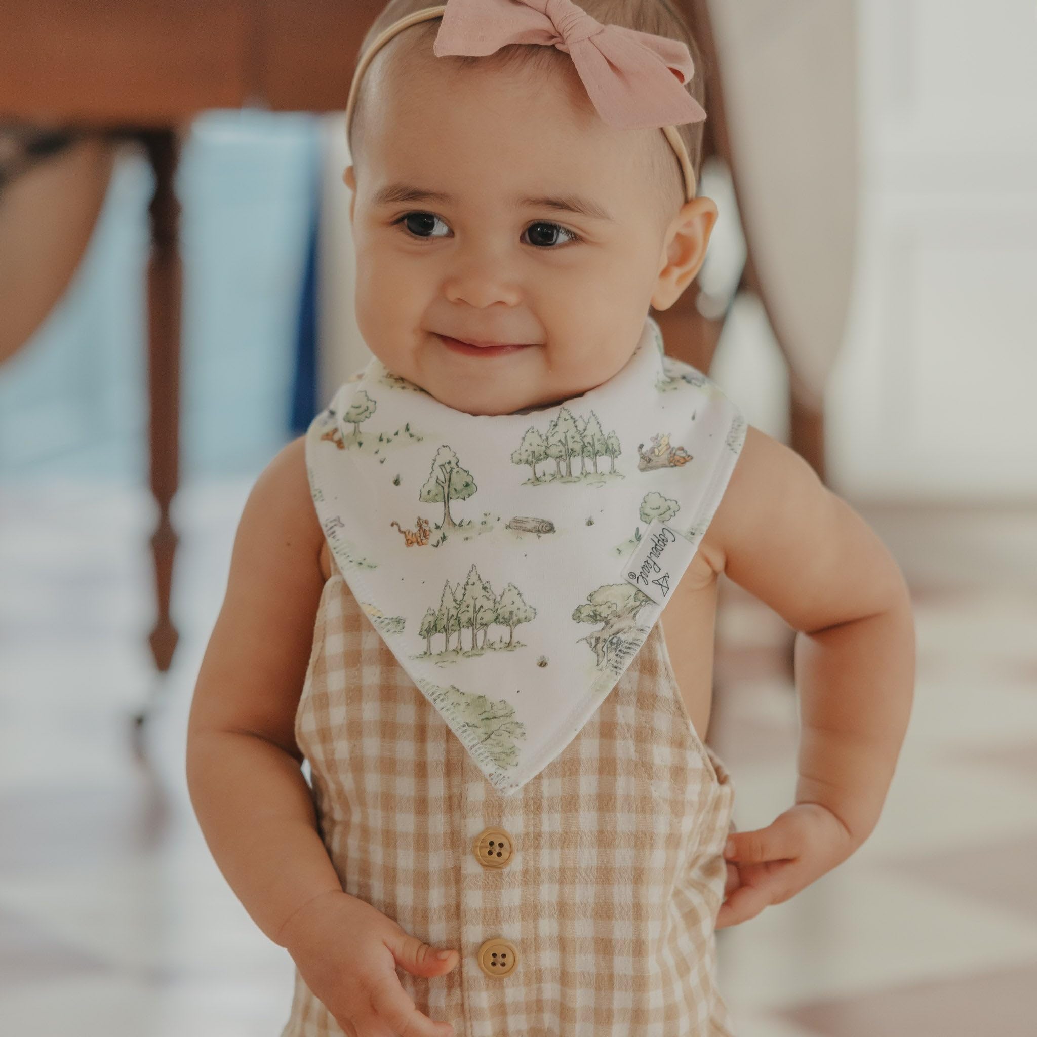 Copper Pearl Winnie Pooh bandana bib doubles as photography prop.