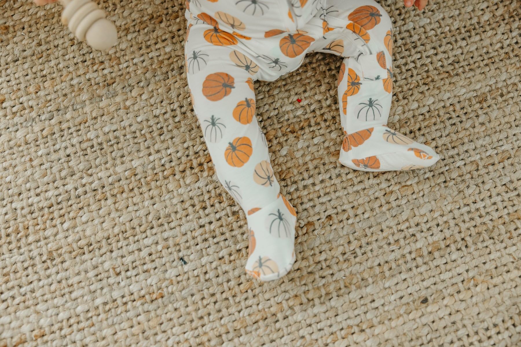 Copper Pearl zip-up footie pajama 0-24-months size range on growing baby.