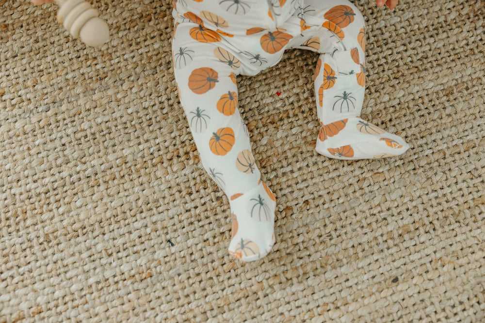 Copper Pearl zip-up footie pajama 0-24-months size range on growing baby.