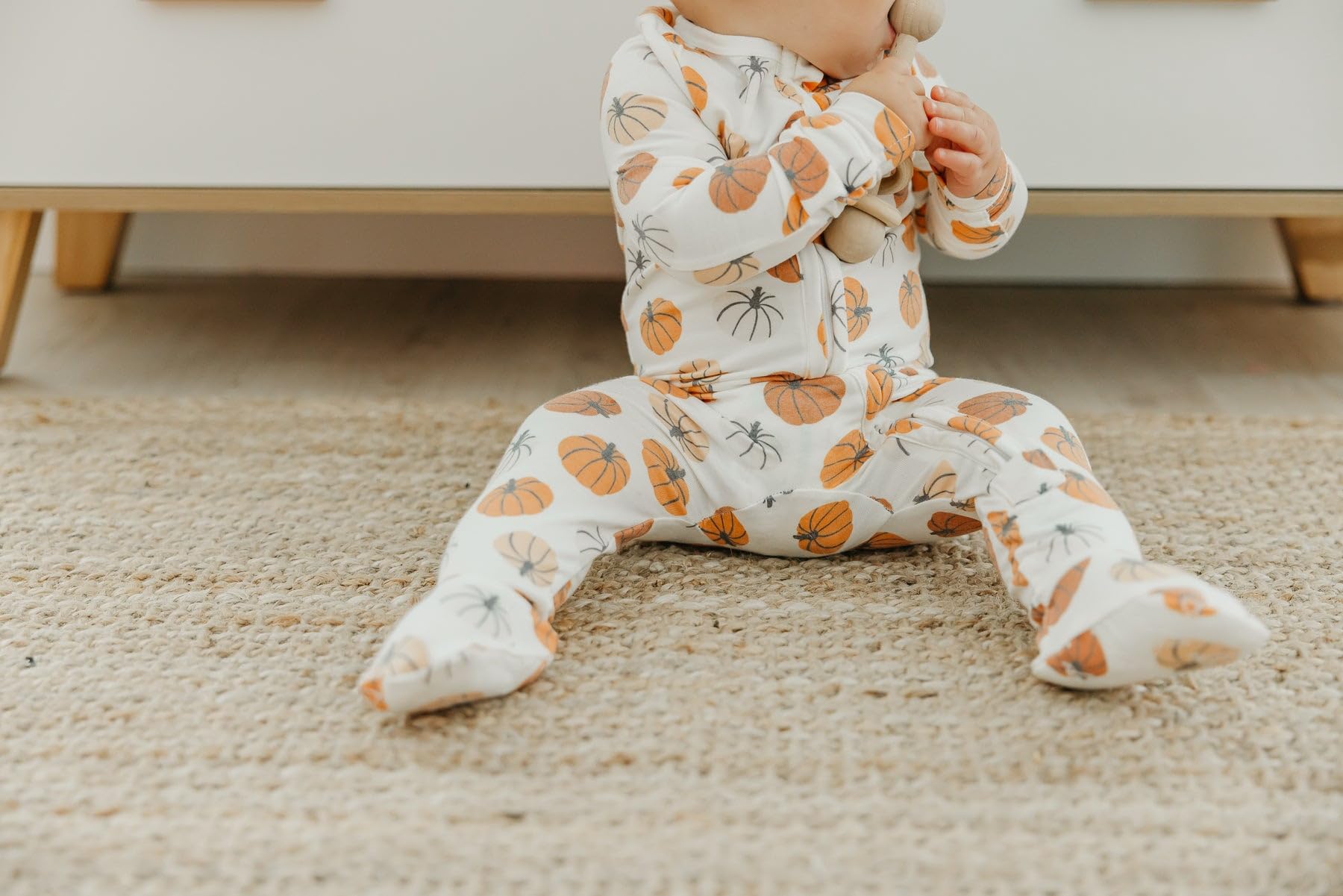 Copper Pearl zip-up footie pajama premium-knit-fabric with stylish prints.