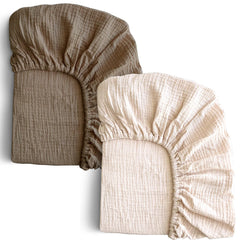 COSMOPLUS Muslin crib sheets in ivory on a standard crib mattress with a snug, secure fit.
