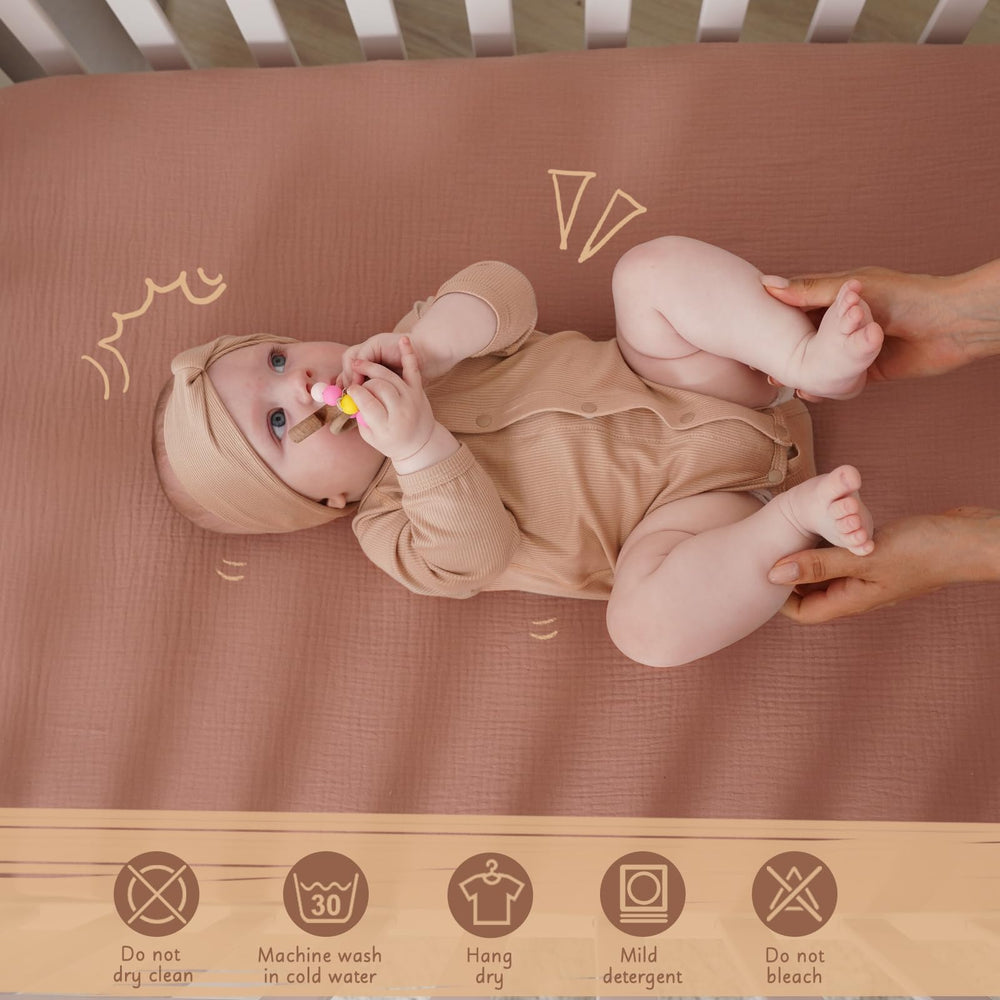 COSMOPLUS Muslin Crib Sheets in neutral boho colors suitable for daily swaps.