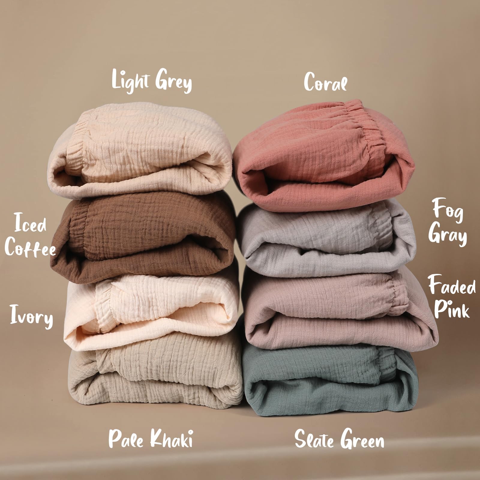 COSMOPLUS Muslin crib sheets two-pack solid colors simplify quick swaps.