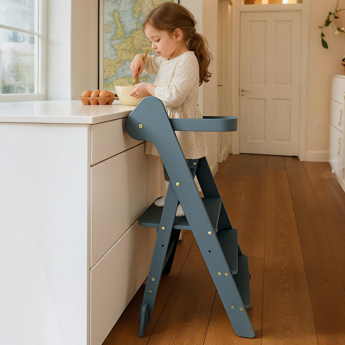 COSYLAND Foldi slate-blue front view demonstrates a sturdy toddler stool for independent kitchen tasks