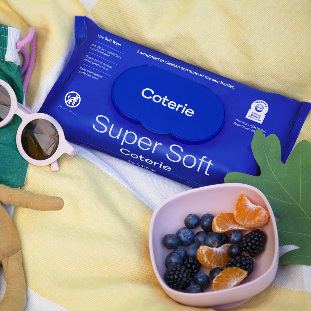 Coterie Baby Soft Wipe diaper-change scene shows quick, mess-ready cleanup.