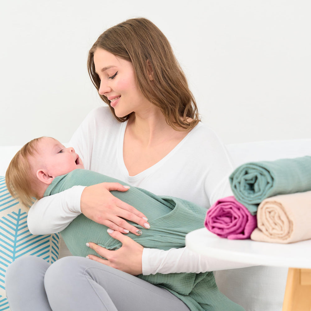 CottCare baby muslin swaddle rose pink fabric close-up highlights soft breathable cotton weave.