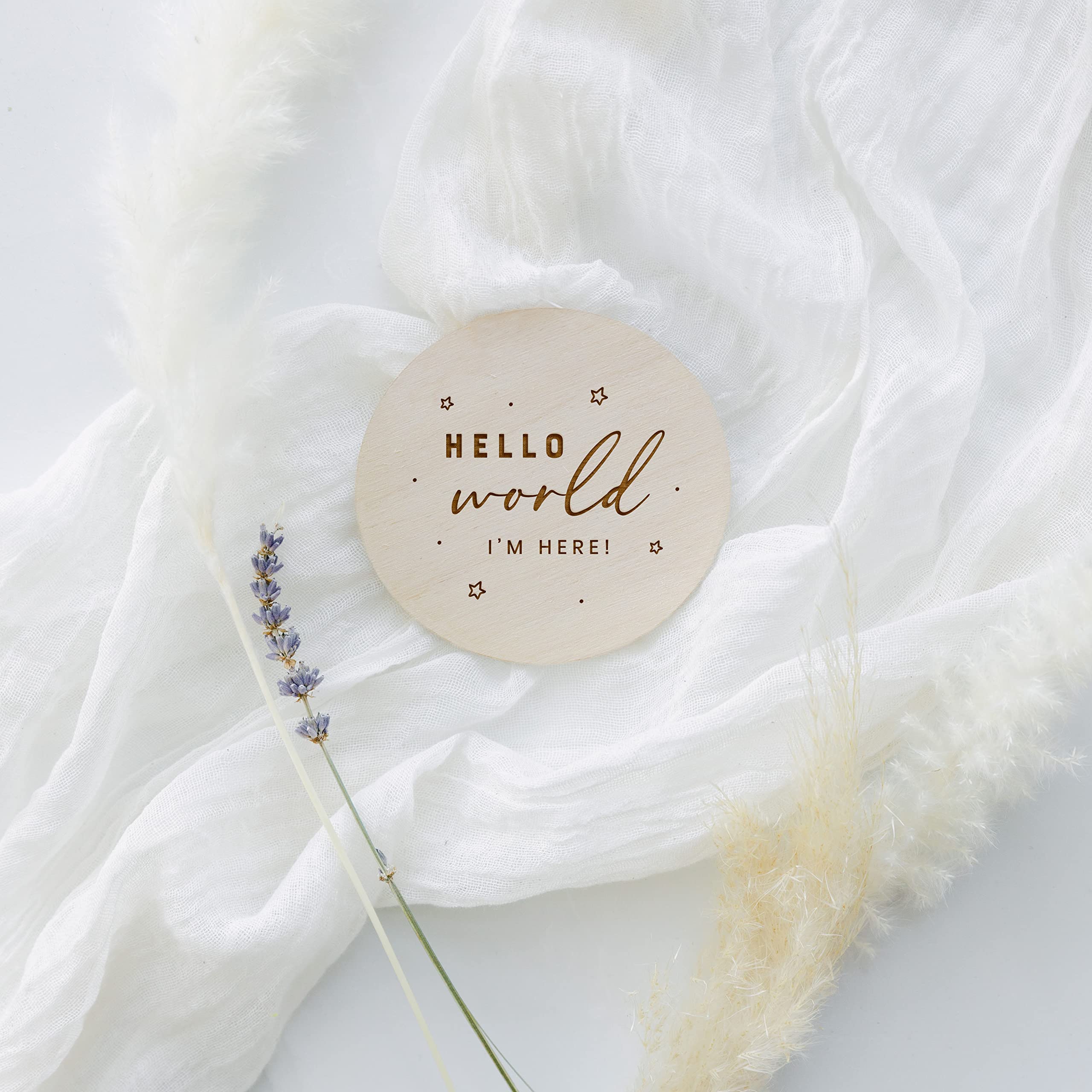 The Cotton & Canvas Co nursery decor natural wood disc enhances nursery display and memories.