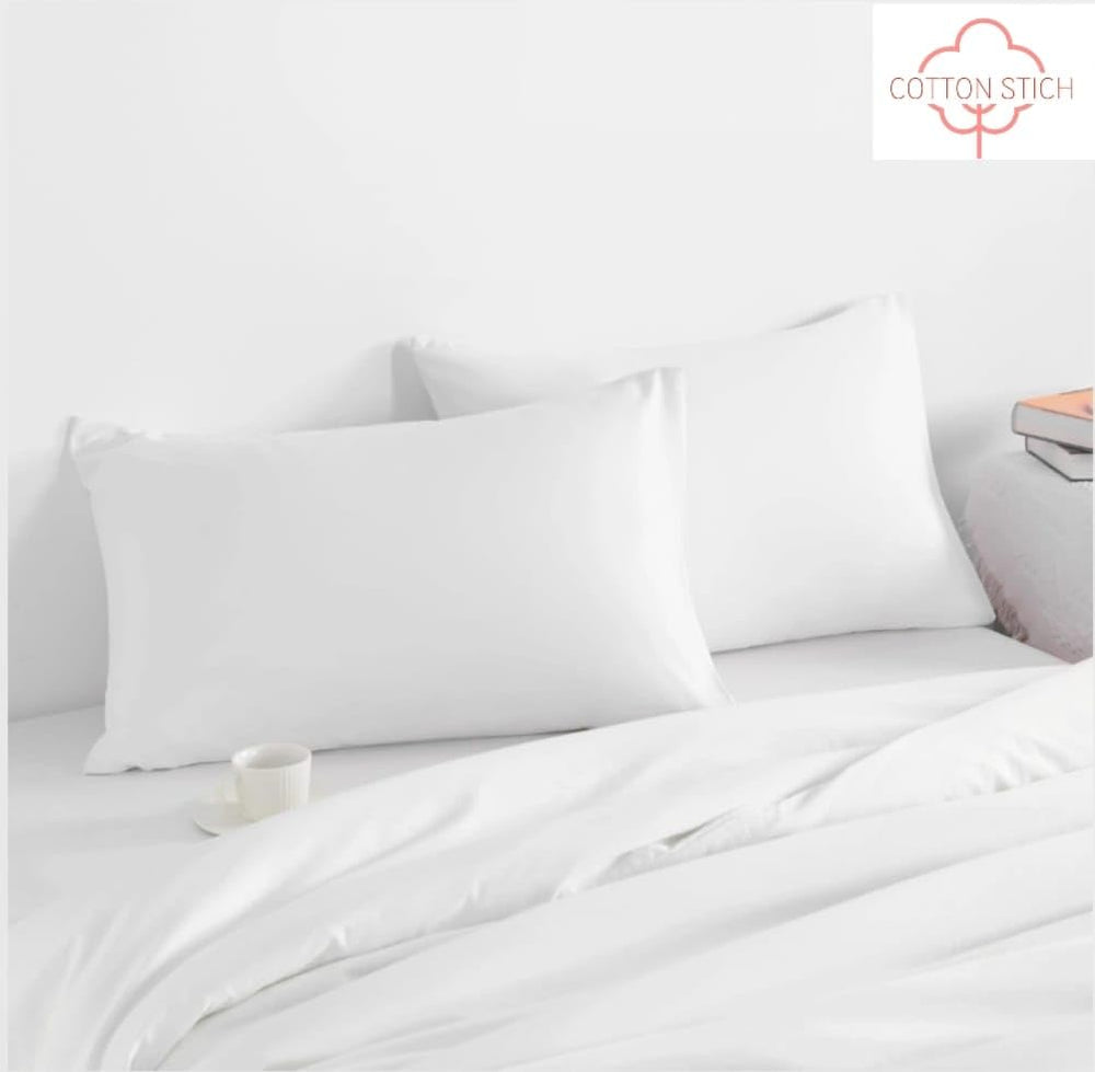 COTTON STICH white solid pillowcase highlights hotel-quality 600TC cotton feel.