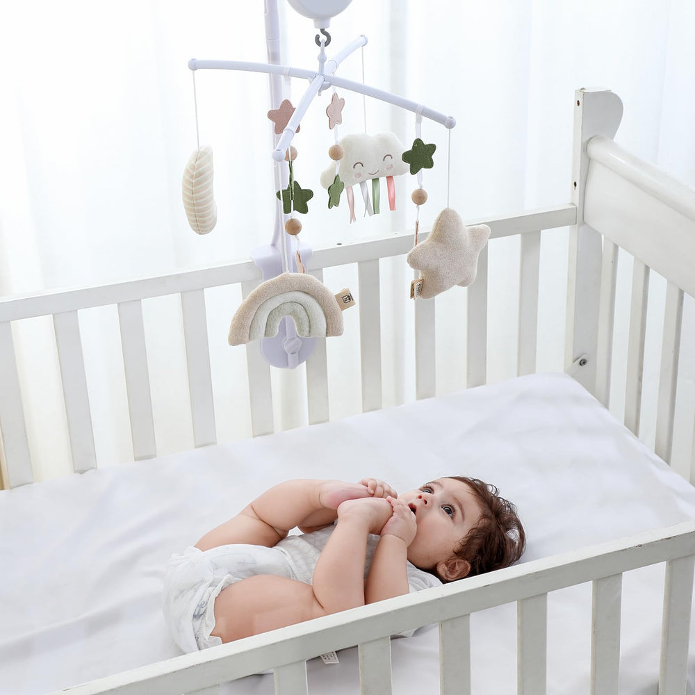 COTTONBEBE crib mobile music control allows tune selection and auto-stop.