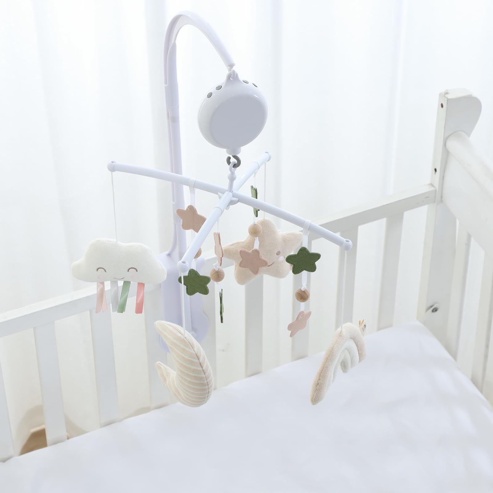 COTTONBEBE crib mobile plush animals create soft focal points for engagement.