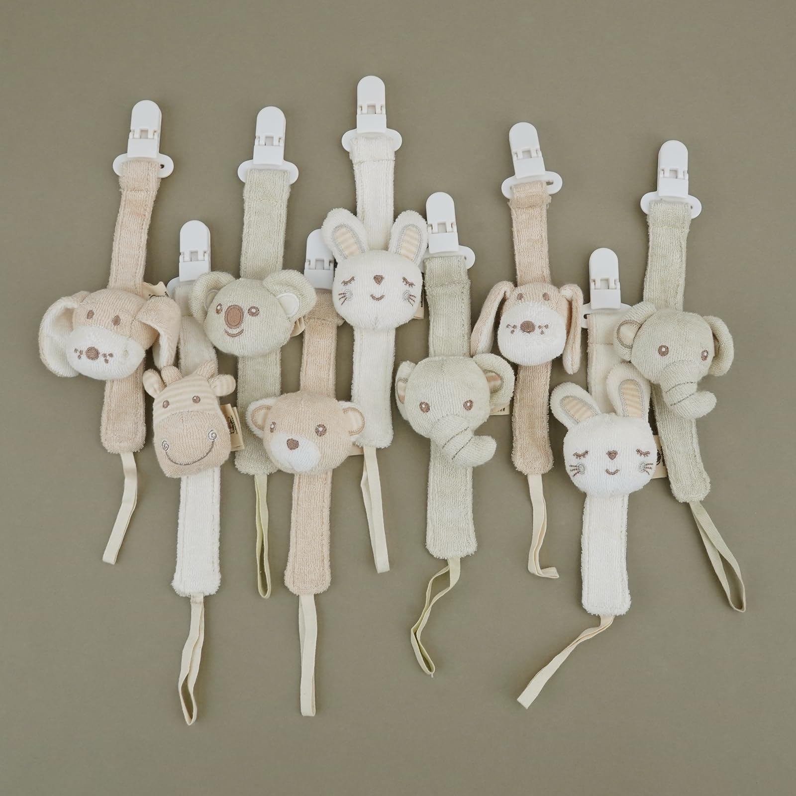 Cottonbebe pacifier clip elephant with bell for soothing play.