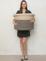 Cottonphant basket open lid reveals hidden storage for clothes and towels.