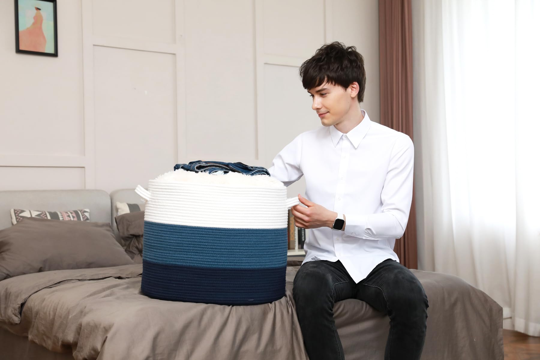 Cottonphant storage basket with open lid for easy access to towels and blankets.