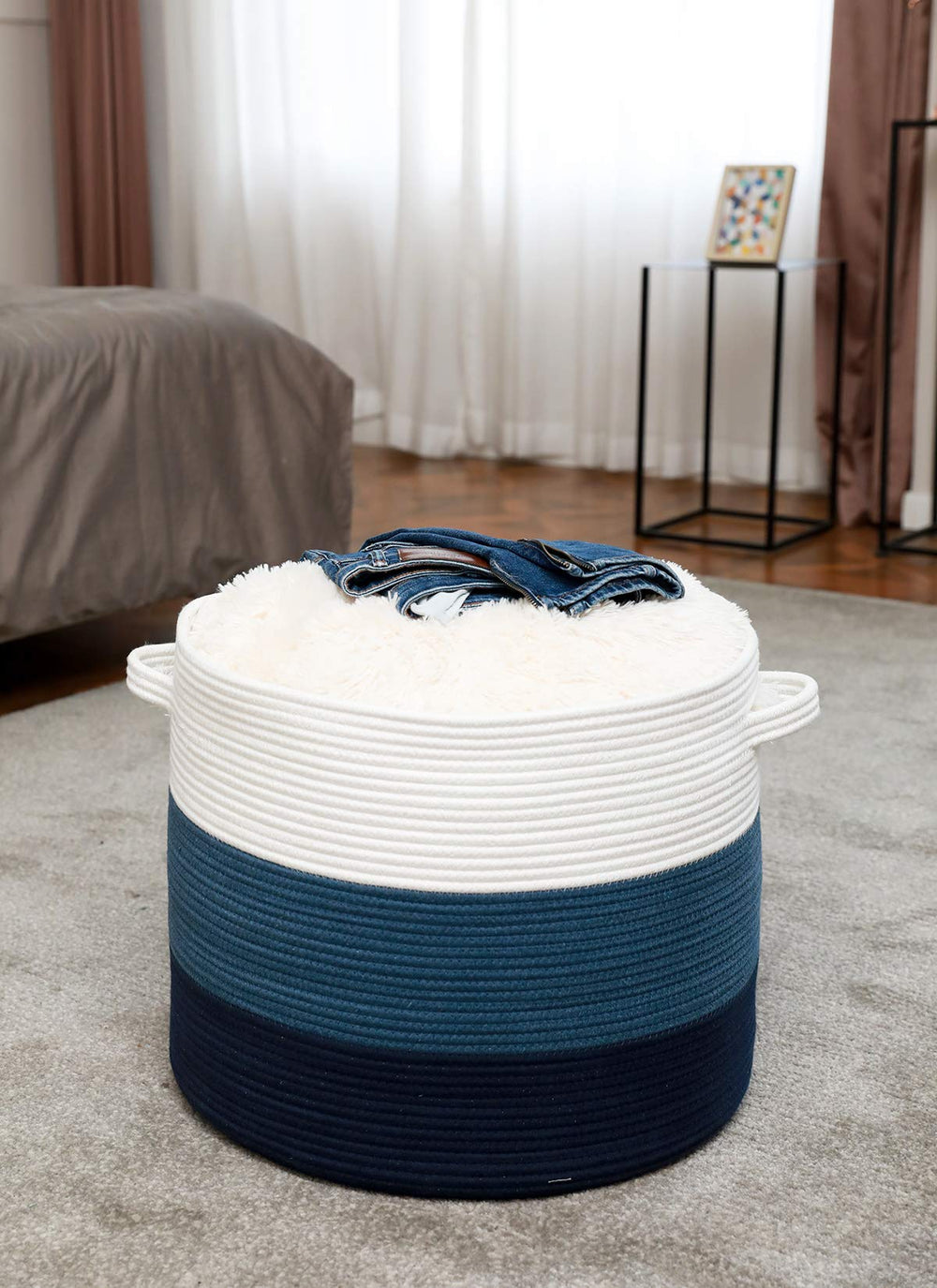 Cottonphant versatile laundry hamper doubles as decorative bedroom storage.