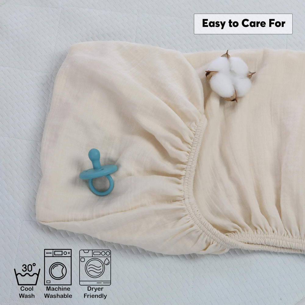 Cottonsis crib sheet deep-9-inch corners closeup demonstrates secure fit on standard mattresses.