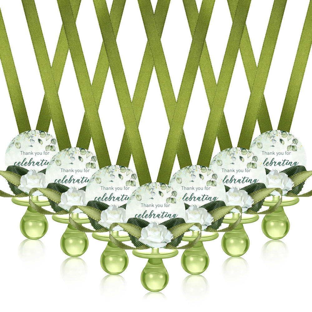 Coume sage-green pacifier necklace closeup — lightweight wearable favor.