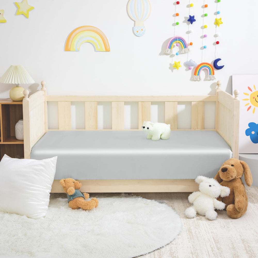 Counfeisly fitted crib sheet edge reveals 8-inch pocket for secure fit.