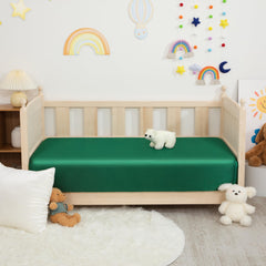 Counfeisly silk satin fitted crib sheet highlights reinforced elastic perimeter for secure fit.