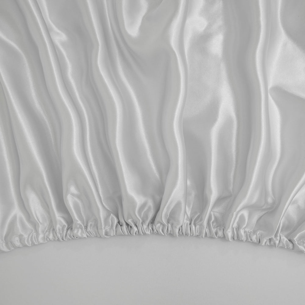 Counfeisly satin sheet laid on mattress highlights temperature-regulating comfort.