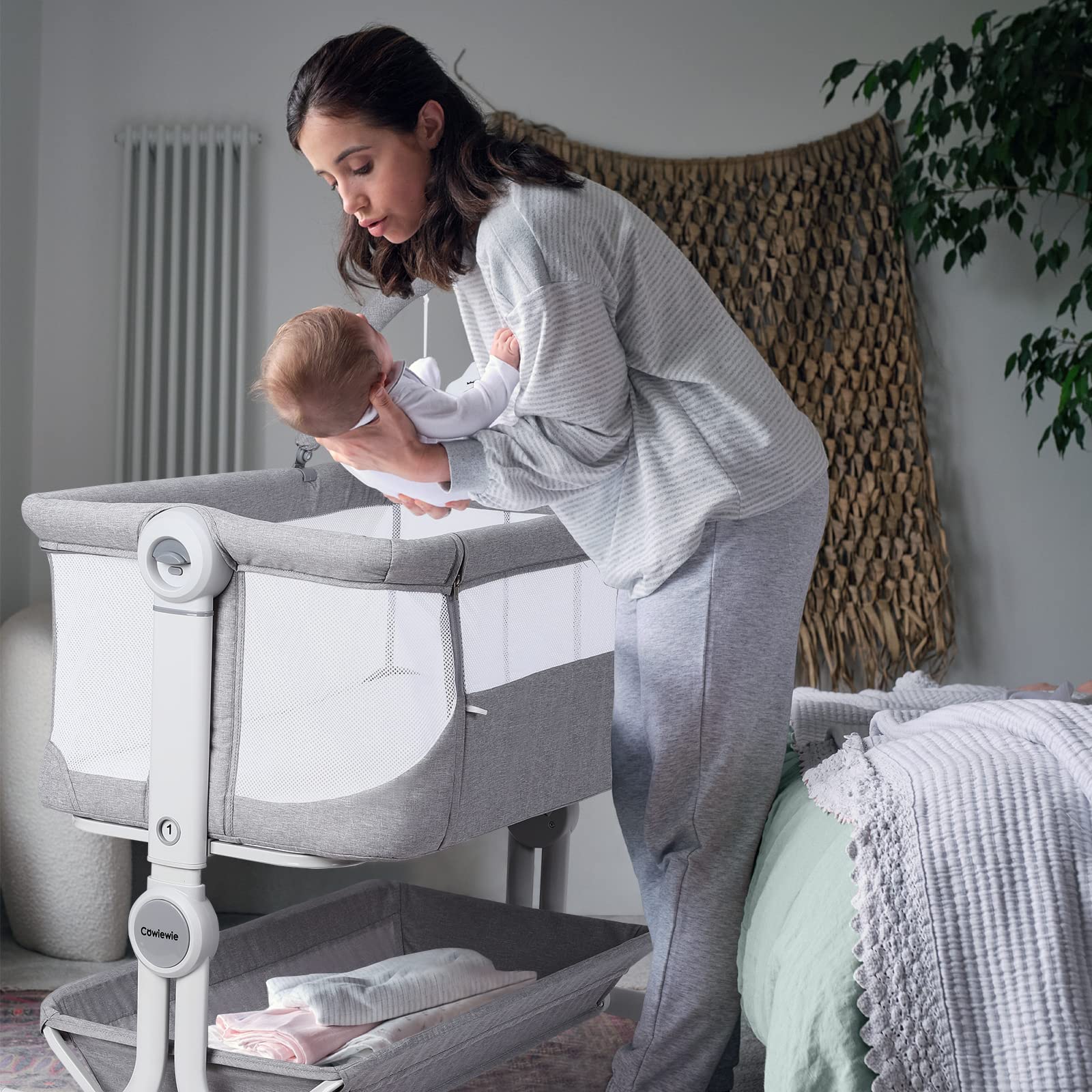 Cowiewie Baby Bassinet cartoon toys promote visual engagement for baby.