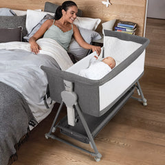 Cowiewie bassinet bedside sleeper with pyramid base provides stable nighttime access.
