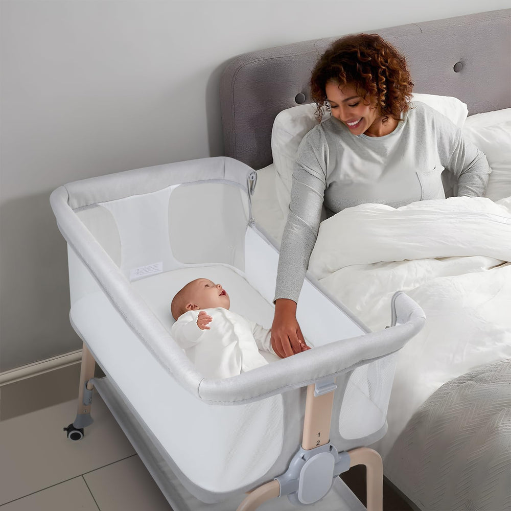 Cowiewie bassinet in light grey matching modern bedroom decor.