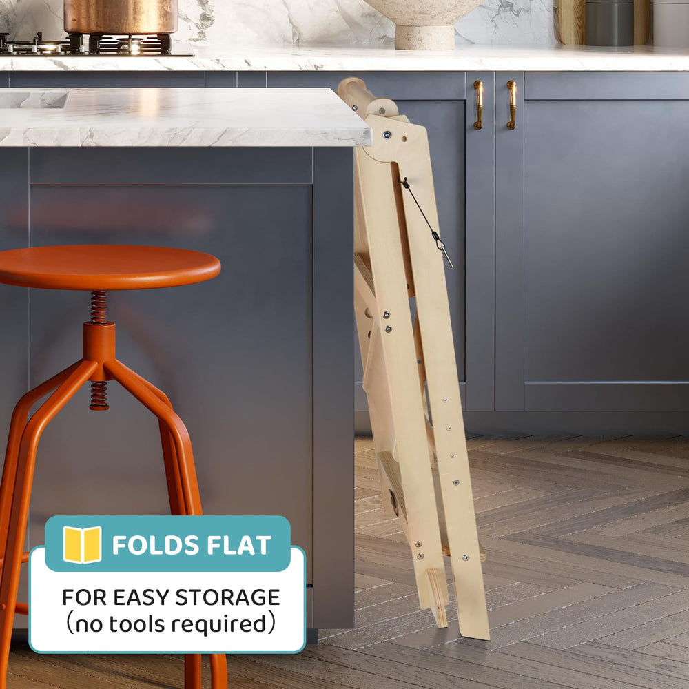Cowiewie Foldable Toddler Tower used at the kitchen counter for activities.