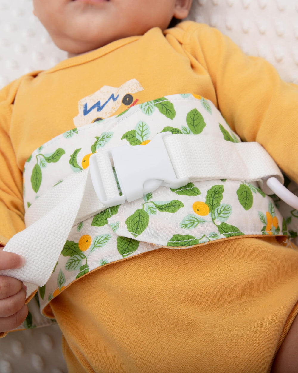 COZINUS Changing Pad Strap in use during diaper change.