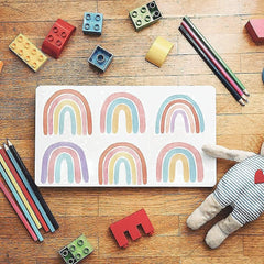 CozyDecor rainbow wall decal creates a cheerful, kid-friendly study or play area.