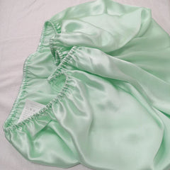 Cozysilk hair-protection sleep silk bassinet highlights reduced friction for gentle baby hair care.