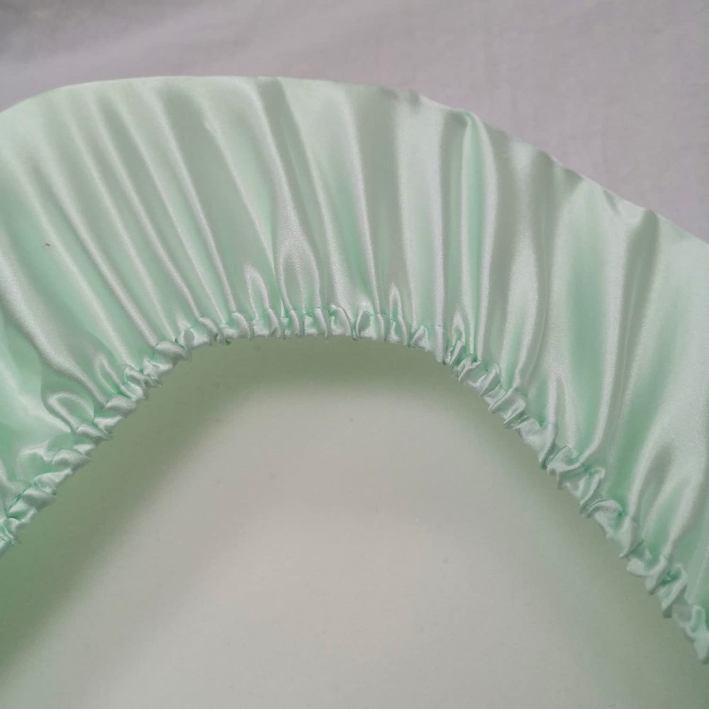Cozysilk secure-elastic bassinet sheet fits snugly to prevent slipping during naps.