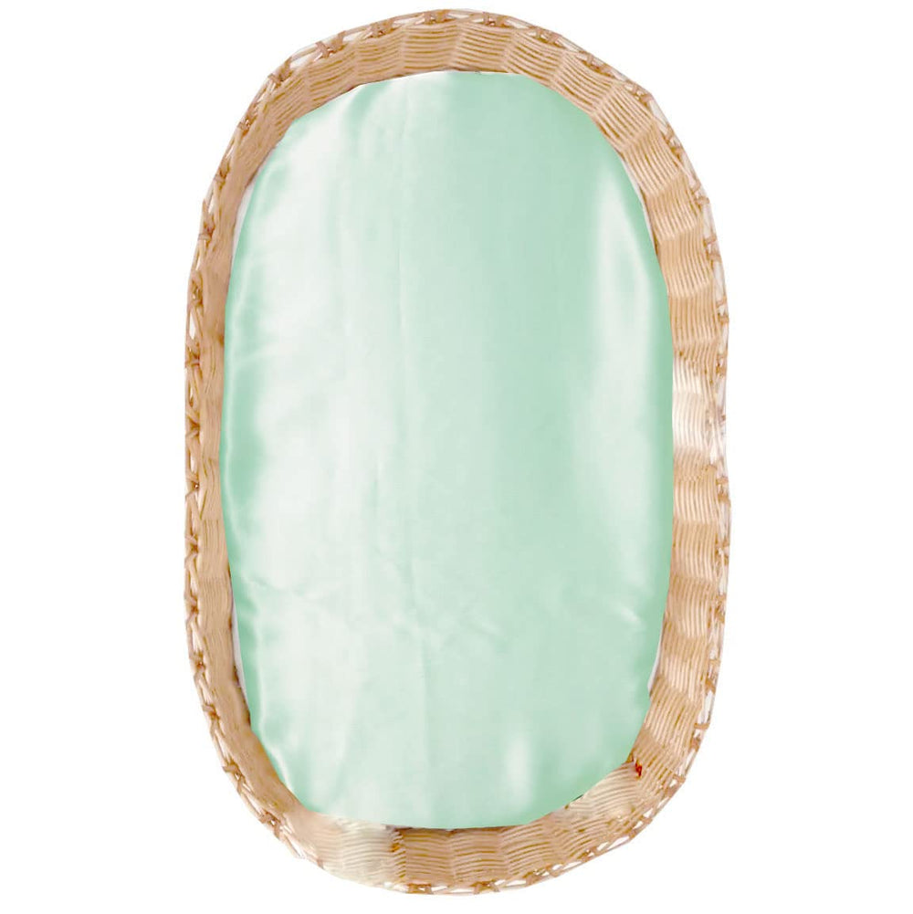Cozysilk silk bassinet sheet in aqua green on mattress for smooth hair and gentle sleep.