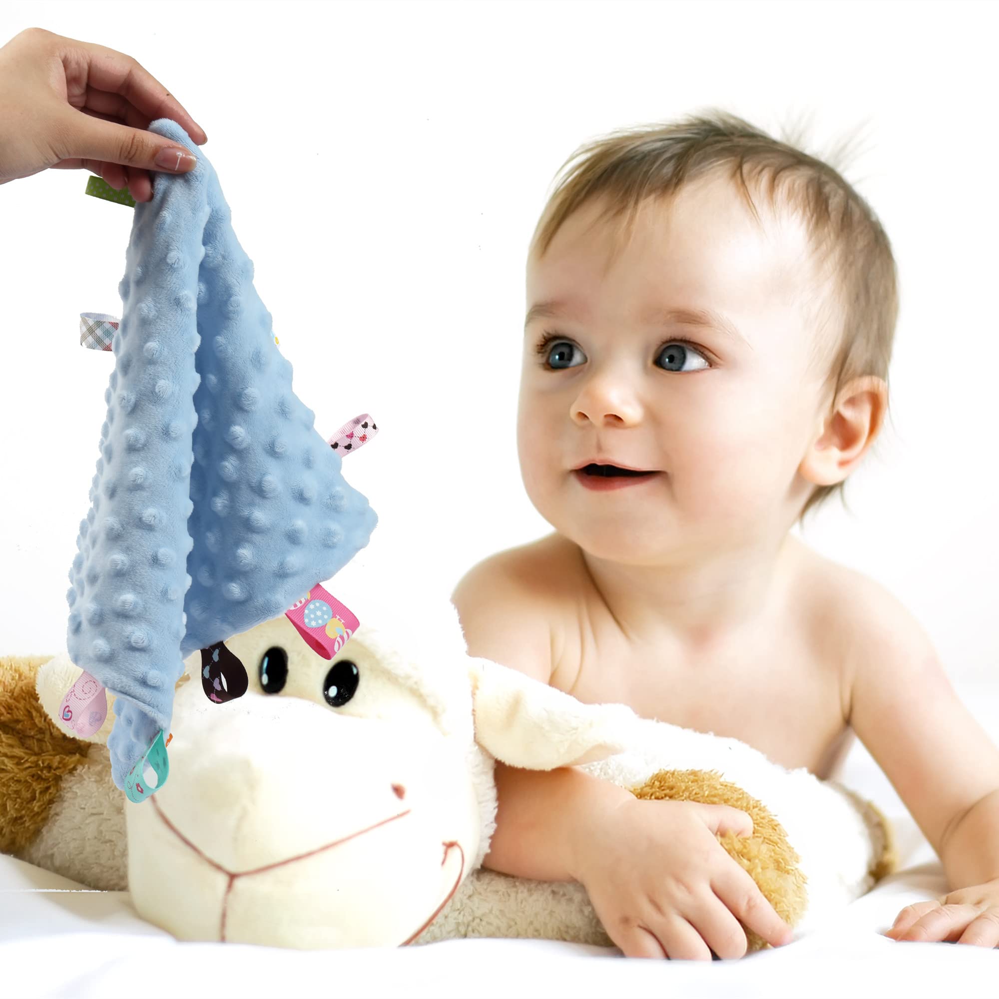 CREVENT blue tag security blanket held by parent for calming nap-time routines.