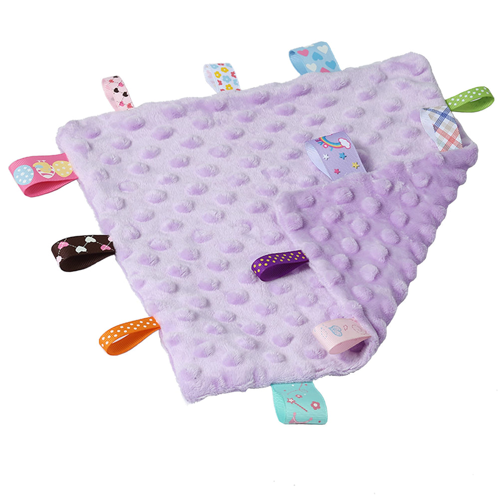 CREVENT blanket showing embroidered taggies for tactile exploration