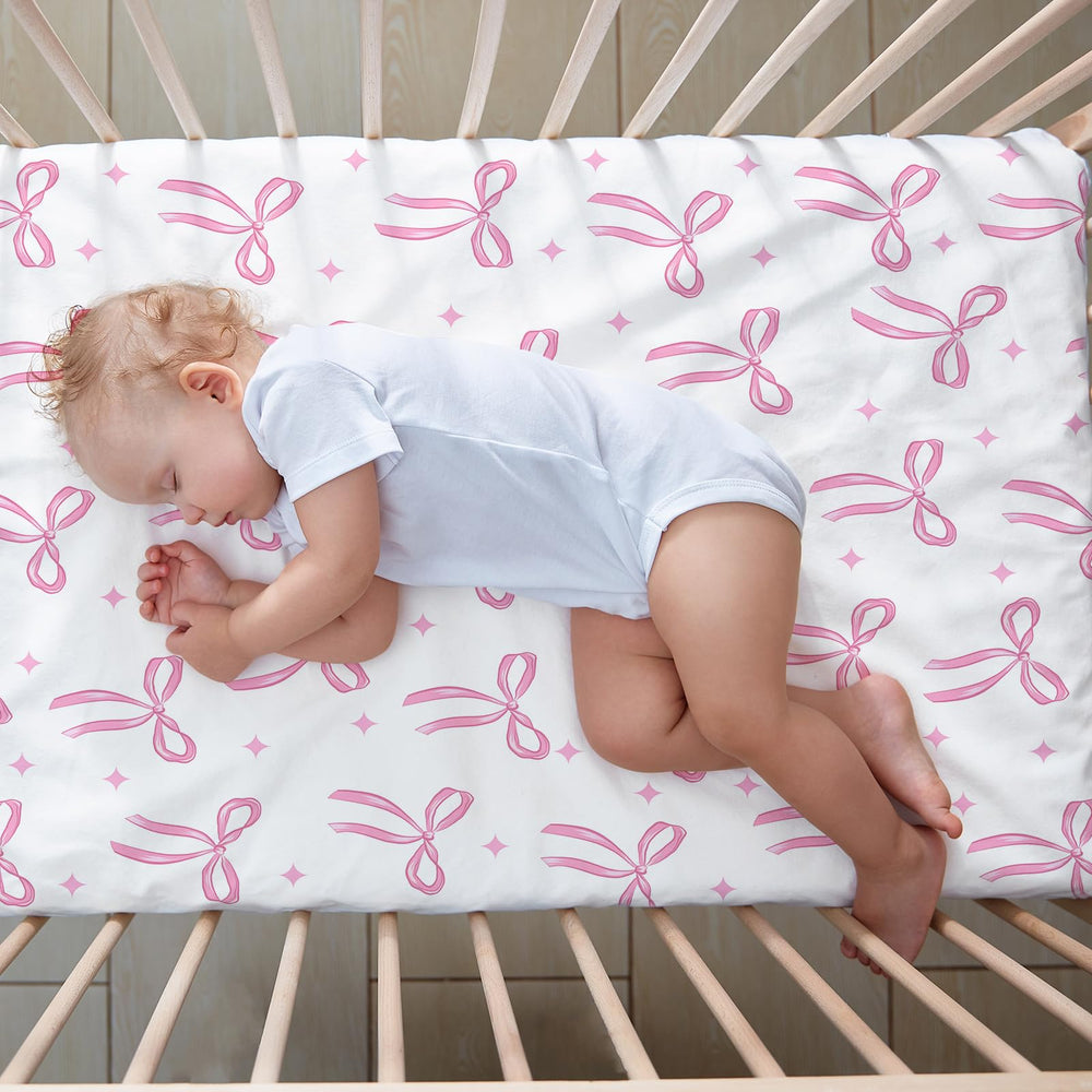 CroBlissful coquette pink bows sheets fit most standard cribs easily.