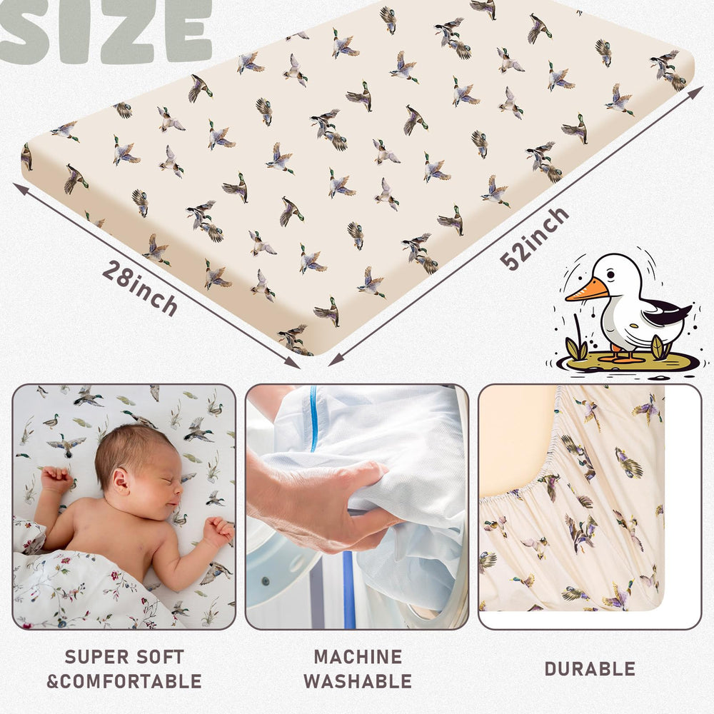 CroBlissful duck-pattern crib sheet on mattress shows secure fit with elastic edges.