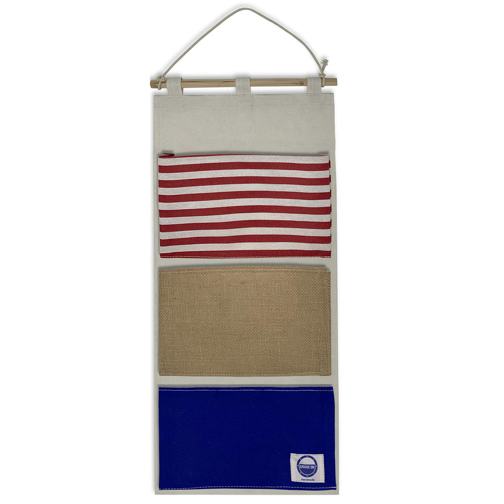 Cruise On fish extender 3-pocket-hanger on cabin door keeps gifts organized for exchanges.