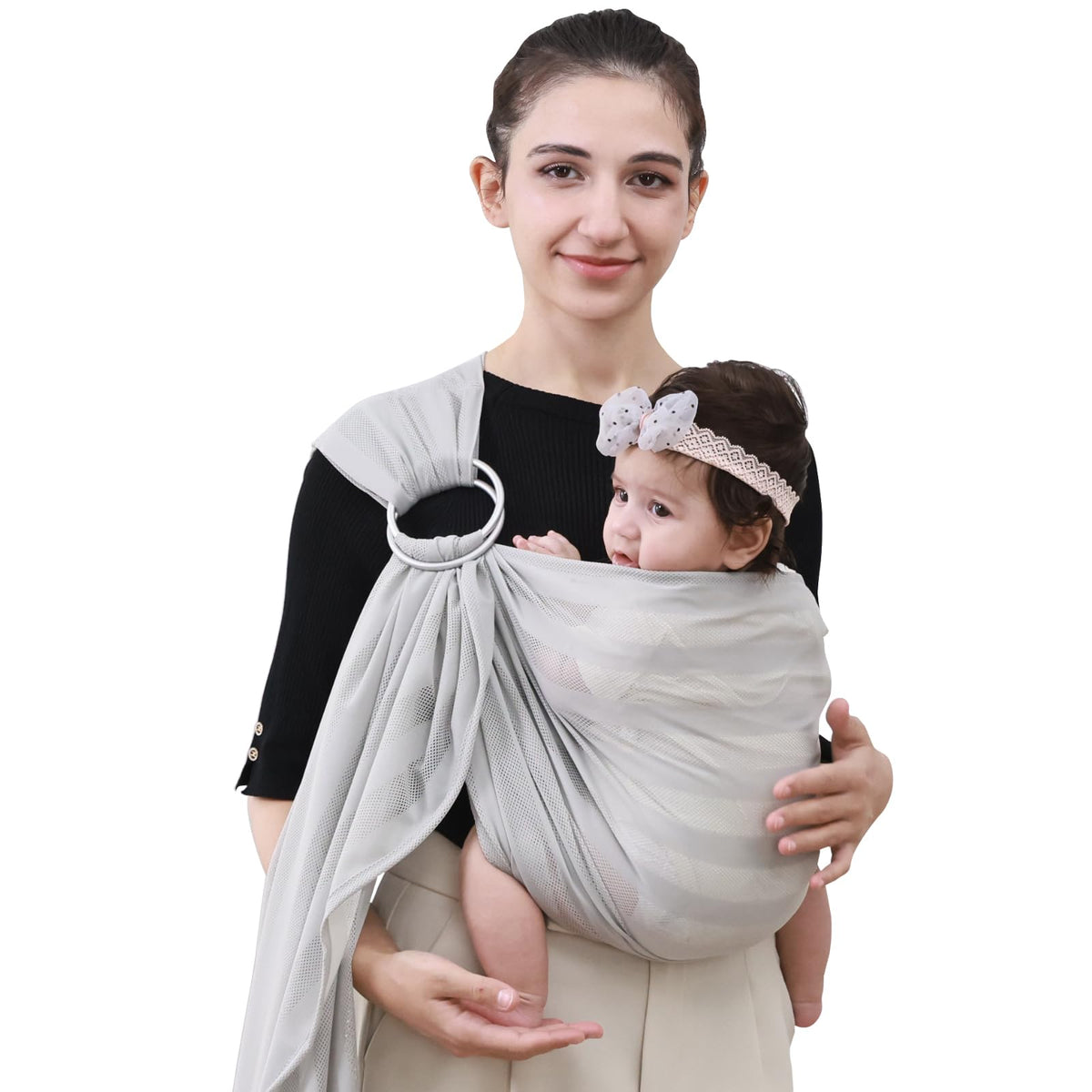 Cuby Water Baby Sling light gray stripe worn for comfortable beach carrying.