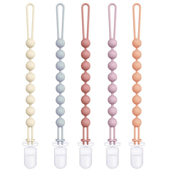 Cuddle Campus silicone pacifier clip with one-piece design for secure attachment.