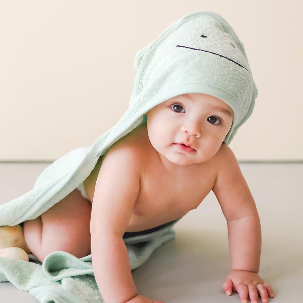CuddleBug sage-green-nursery-setup charming frog theme for early bath routines
