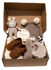 CUDDLECUBS signature gift box knitted onesie folded on a soft surface, newborn comfort