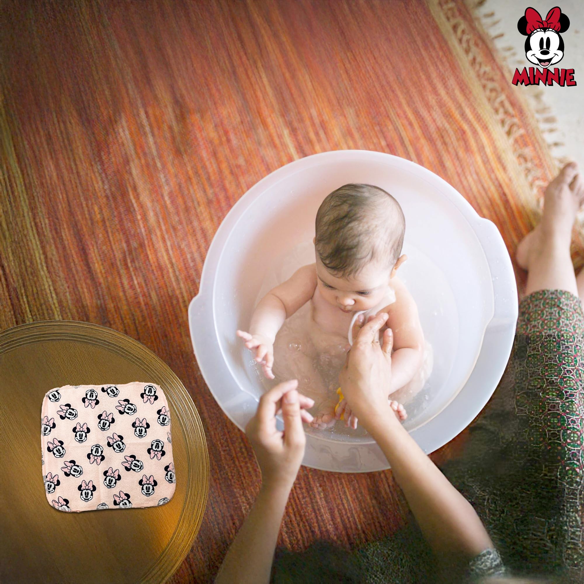 Cudlie Minnie-face towel detail emphasizes cute print and comforting bath experience.