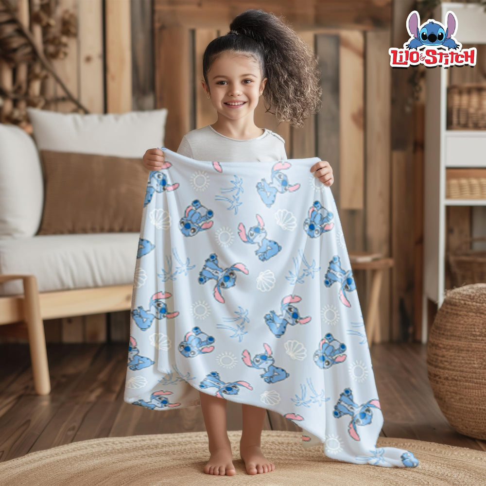 Cudlie Stitch Blanket blue draped for stroller time.