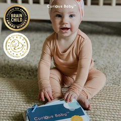 Curious Baby playbook for first-time parents offers easy daily activities.