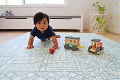 Cushmat reversible-foam-play-mat coral-teal side shown enhances kids room aesthetics.