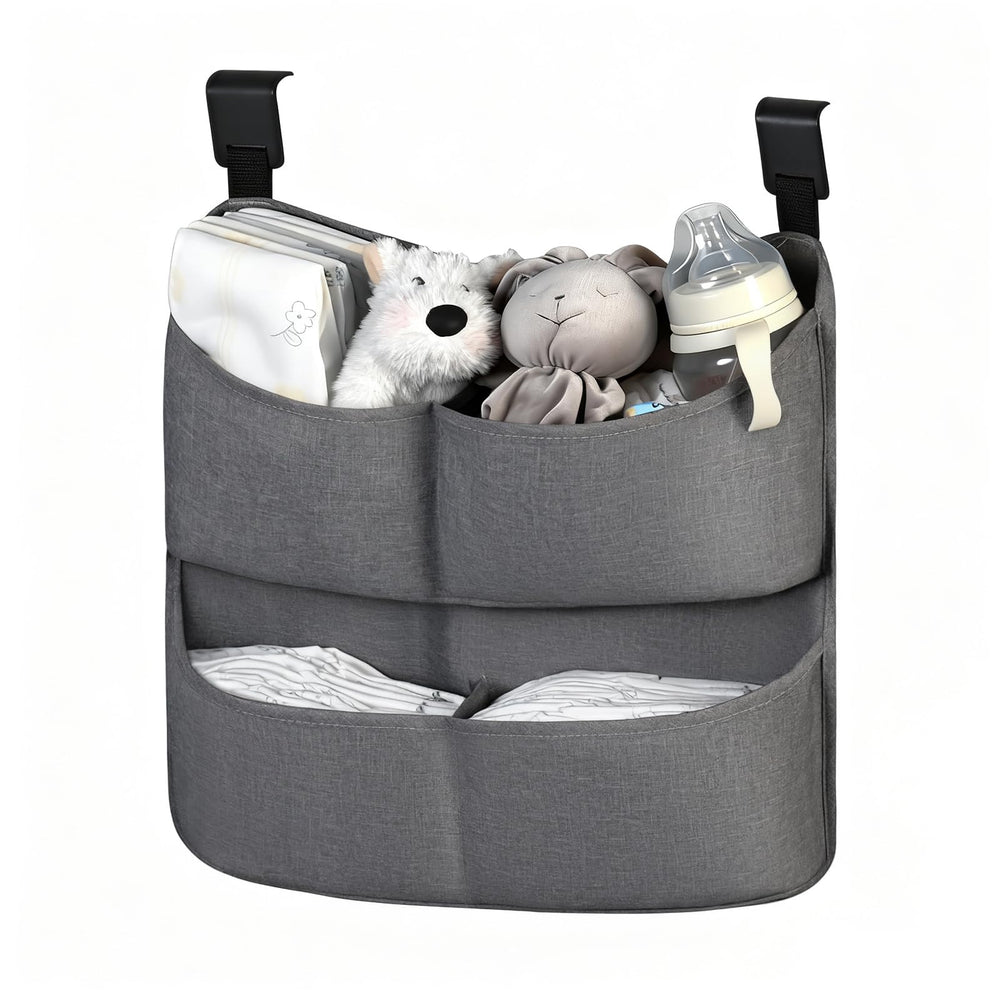 Cutebeams diaper caddy hanging on crib with four pockets for quick access
