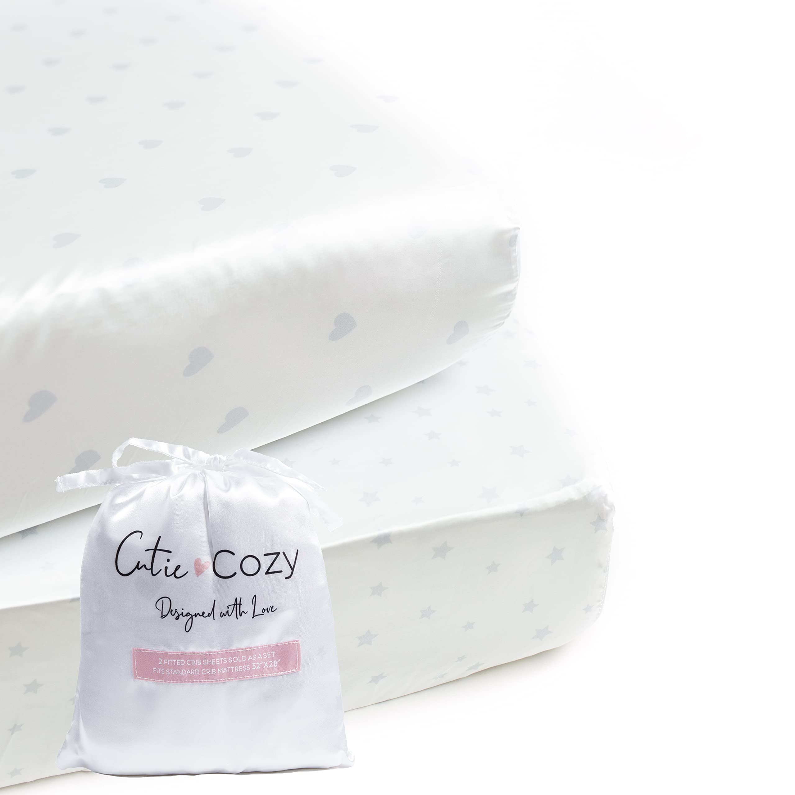 CutieCozy satin crib sheet set in white with hearts and stars, gentle on delicate baby hair.